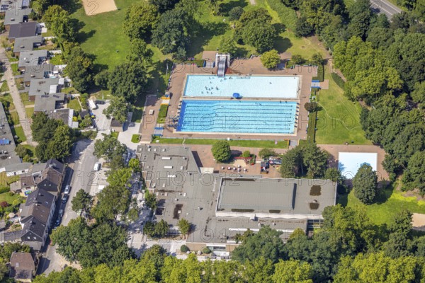 Aerial view, outdoor swimming pool Homberg with swimming pool and bathers, lifeguard with parasol at the edge of the pool, Alt-Homberg, Duisburg, Ruhr area, North Rhine-Westphalia, Germany, bathing establishment, bathing resort, DE, Europe, outdoor swimming pool, leisure activities, aerial view, aerial photography, aerial photography, swimming pool, swimming pool, overview, bird's-eye view, overview