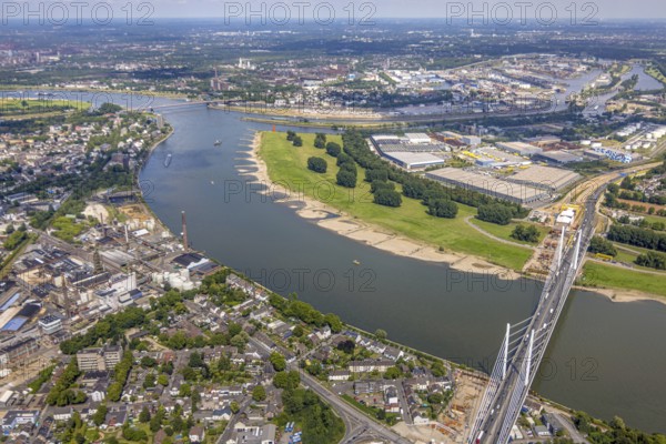Aerial view, major construction site Rhine bridge Neuenkamp with motorway A40 over the river Rhine, view to Duisburg harbour, Alt-Homberg, Duisburg, Ruhr area, North Rhine-Westphalia, Germany, architecture, motorway A40, motorway bridge, construction cranes, construction site, bridge construction, DE, development, Europe, river Rhine, river crossing, commercial area, major construction site, autumn, industrial area, infrastructure, engineering, construction, aerial view, aerial photography, aerial photography, planning, Rhine bridge Neuenkamp, settlement, city, urban landscape, urban, daylight, technology, transport, overview, traffic, traffic routes, bird's eye view, waterway, future, birds-eyes view, duisport, modern technology, overview, overview