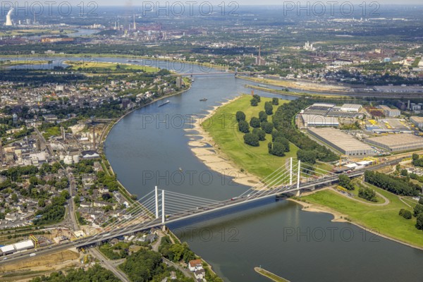 Aerial view, major construction site Rhine bridge Neuenkamp with motorway A40 over the river Rhine, Alt-Homberg, Duisburg, Ruhr area, North Rhine-Westphalia, Germany, architecture, motorway A40, motorway bridge, construction cranes, construction site, bridge construction, DE, development, Europe, river Rhine, river crossing, commercial area, major construction site, autumn, industrial area, infrastructure, engineering, construction, aerial view, aerial photography, aerial photography, planning, Rhine bridge Neuenkamp, settlement, city, cityscape, urban, urban, daylight, technology, transport, overview, traffic, traffic routes, bird's eye view, waterway, future, birds-eyes view, duisport, modern technology, overview, overview