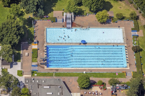 Aerial view, outdoor swimming pool Homberg with swimming pool and bathers, lifeguard with parasol at the edge of the pool, Alt-Homberg, Duisburg, Ruhr area, North Rhine-Westphalia, Germany, bathing establishment, bathing resort, DE, Europe, outdoor swimming pool, leisure activities, aerial view, aerial photography, aerial photography, swimming pool, swimming pool, overview, bird's-eye view, overview