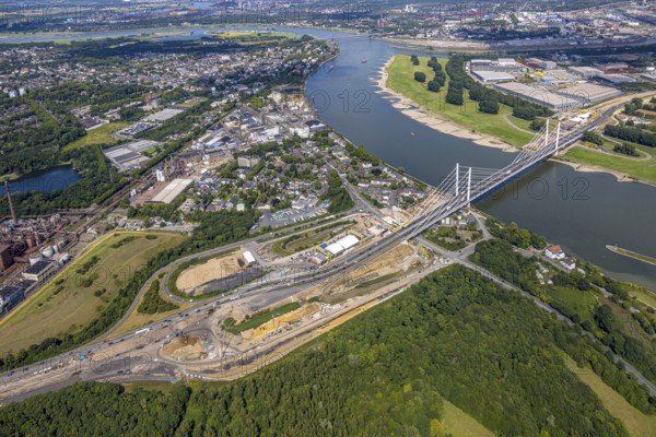 Aerial view, major construction site Rhine bridge Neuenkamp with motorway A40 over the river Rhine, junction Homberg, Alt-Homberg, Duisburg, Ruhr area, North Rhine-Westphalia, Germany, architecture, motorway A40, motorway bridge, construction cranes, construction site, bridge construction, DE, development, Europe, river Rhine, river crossing, commercial area, major construction site, autumn, industrial area, infrastructure, engineering, construction, aerial view, aerial photography, aerial photography, planning, Rhine bridge Neuenkamp, settlement, city, urban landscape, urban, daylight, technology, transport, overview, traffic, traffic routes, bird's eye view, waterway, future, birds-eyes view, duisport, modern technology, overview, overview