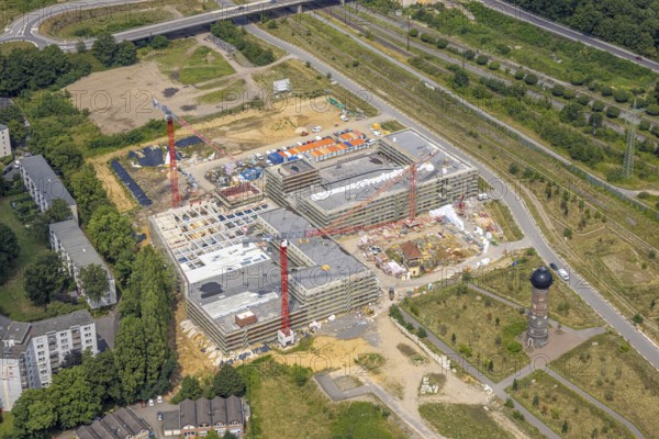 Aerial view, construction site with new building at the former Wedau marshalling yard for a new Duisburg residential quarter on the Sechs-Seen-Platte, water tower, Wedau, Duisburg, Ruhr area, North Rhine-Westphalia, Germany