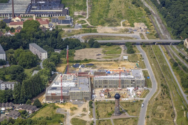 Aerial view, construction site with new building at the former Wedau marshalling yard for a new Duisburg residential quarter on the Sechs-Seen-Platte, water tower, Wedau, Duisburg, Ruhr area, North Rhine-Westphalia, Germany
