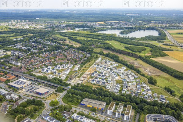 Aerial view, Duisburg-Süd, residential area Angerbogen, Am Alten Angerbach, semi-circular new housing estate, commercial area Xella International GmbH and Edeka E-Center Angerbogen, roofed railway station Angerbogen, behind the Rahmer See, Huckingen, Duisburg, Ruhr area, North Rhine-Westphalia, Germany