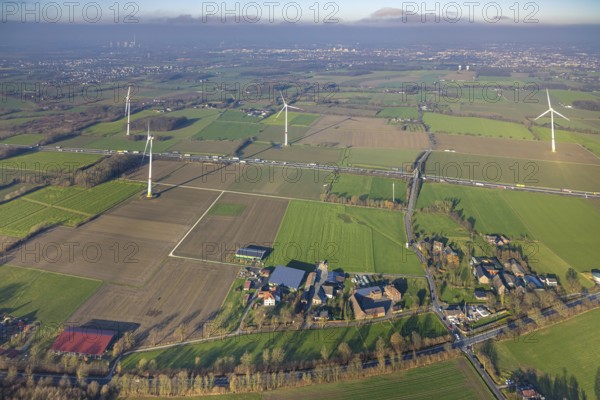 Aerial view, housing estate district Freiske and wind turbines Wind turbines at the motorway A2 with truck traffic, view to Hamm, district Rhynern, Hamm, Ruhr area, North Rhine-Westphalia, Germany