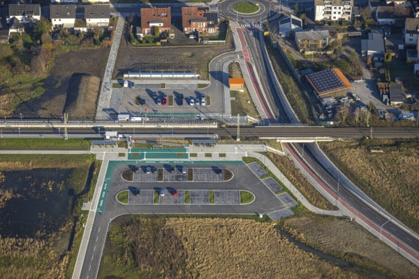 Aerial view, planned local transport connection with stop in Westtünnen, construction site at Südfeldweg and Von-Thünen-Straße for the future railway stop, railway line with railway bridge and housing estate with roundabout, Rhynern district, Hamm, Ruhr area, North Rhine-Westphalia, Germany