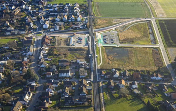 Aerial view, planned local transport connection with stop in Westtünnen, construction site at Südfeldweg and Von-Thünen-Straße for the future railway stop, railway line with railway bridge and housing estate with roundabout, Rhynern district, Hamm, Ruhr area, North Rhine-Westphalia, Germany