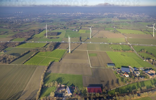 Aerial view, housing estate district Freiske and wind turbines Wind turbines at the motorway A2 with truck traffic, view to Hamm, district Rhynern, Hamm, Ruhr area, North Rhine-Westphalia, Germany