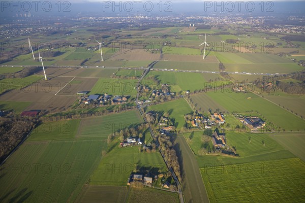 Aerial view, housing estate district Freiske and wind turbines Wind turbines at the motorway A2 with truck traffic, view to Hamm, district Rhynern, Hamm, Ruhr area, North Rhine-Westphalia, Germany