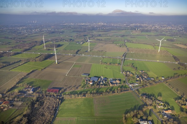 Aerial view, housing estate district Freiske and wind turbines Wind turbines at the motorway A2 with truck traffic, view to Hamm, district Rhynern, Hamm, Ruhr area, North Rhine-Westphalia, Germany