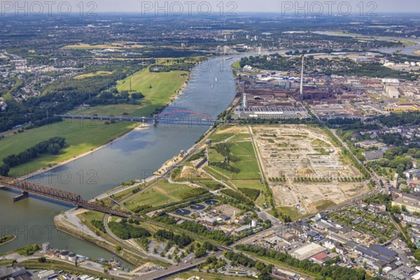 Aerial view, Rheinpark Duisburg on the river Rhine and planned residential complex RheinOrt Hochfeld, Bridge of Solidarity and Hochfeld railway bridge over the river Rhine, behind DK Recycling und Roheisen GmbH Werk Kupferhütte, Hochfeld, Duisburg, Ruhr area, North Rhine-Westphalia, Germany