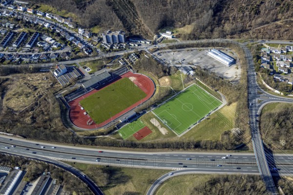 Aerial view, Erich-Berlet-Stadion, formerly Kirchenbergstadion, football stadium and athletics stadium with adjacent pitch, on the A46 motorway, refugee accommodation container village Kirchenberg, Hohenlimburg, Hagen, Ruhr area, North Rhine-Westphalia, Germany