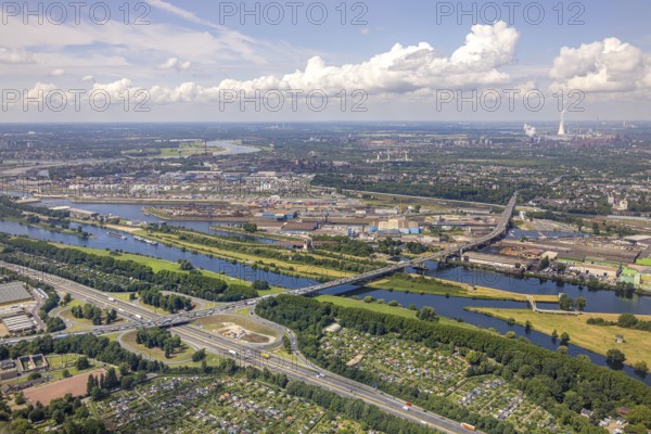 Aerial view, Berlin bridge of motorway A59 over river Ruhr and Rhine-Herne-Canal between motorway junction Duisburg and harbour Duisburg, allotment garden association Ruhrwiesen, distant view and blue sky with clouds, Duissern, Duisburg, Ruhr area, North Rhine-Westphalia, Germany