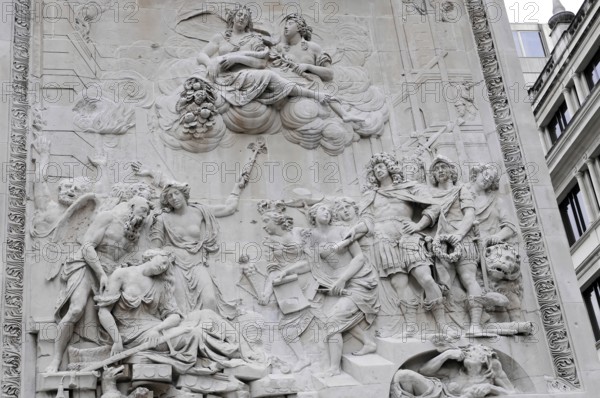 Detailed stone relief with several figures and ornate elements, London, England, Great Britain