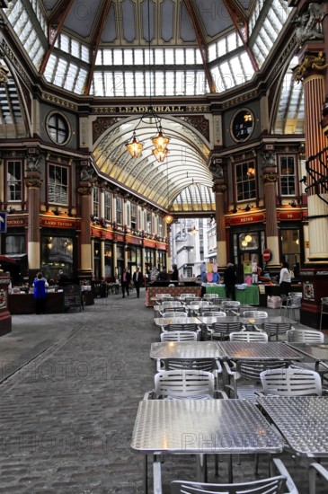 Interior view, Leadenhall Market, London, England, Great Britain, Spacious covered market hall with seating and ornate windows, London, England, Great Britain