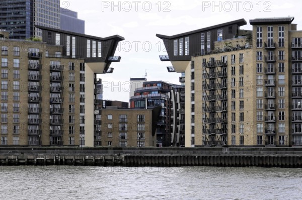London, England, Great Britain, Europe, Modern residential buildings with unique roof shapes on the riverside