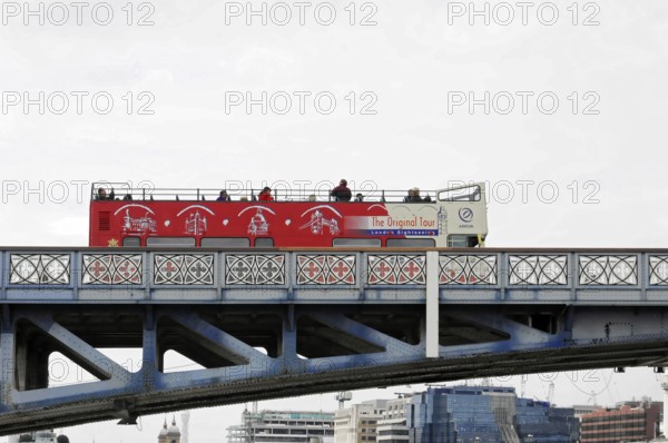London, England, Great Britain, Europe, Red double-decker bus for city tours on a bridge