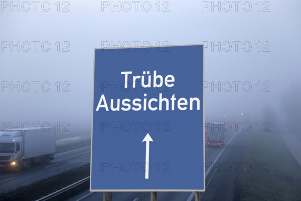 (Photomontage) Motorway sign with the inscription TRÜBE AUSSICHTEN above a foggy motorway
