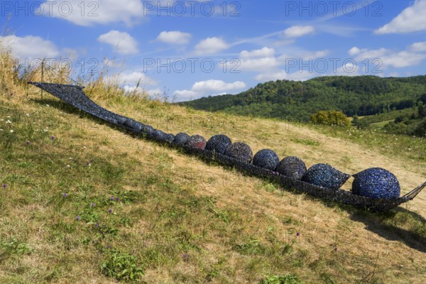 Installation with a hammock, video tape and magnetic tape, HAMACA by Elke Wessel, 12th international wind art festival 2025, landscape exhibition bewegter wind, Zierenberg, Northern Hesse, Germany