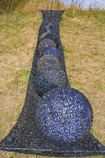 Installation with a hammock, video tape and magnetic tape, HAMACA by Elke Wessel, 12th international wind art festival 2025, landscape exhibition bewegter wind, Zierenberg, Northern Hesse, Germany