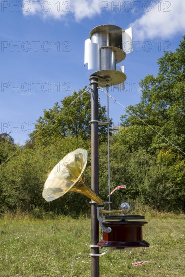 The object Music of the Weather Cycle- wind driven record player and Wind Driven AI Generator by Wolfram Spyra, Adrian Palka und Patricia Routh - the impossible trio, 12th international wind art festival 2025, landscape exhibition bewegter wind, Zierenberg, Northern Hesse, Germany
