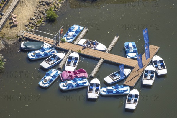 Aerial view, pedal boats at the landing stage at the Biggesee boathouse, people in the boat, shapes and colours, Olpe town, Olpe, Sauerland, North Rhine-Westphalia, Germany