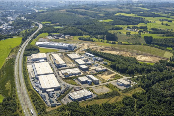 Aerial view, industrial estate Konrad-Zuse-Straße with construction site, in the background construction site and new building of the hazard prevention centre (GAZ) of the district of Olpe Am Bratzkopf, motorway A45, Dahl, Olpe, Sauerland, North Rhine-Westphalia, Germany