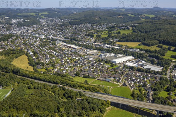 Aerial view, residential area Olpe-Süd Rüblinghausen with motorway A45, industrial area In der Trift, wooded hilly landscape with distant view, Dahl, Olpe, Sauerland, North Rhine-Westphalia, Germany