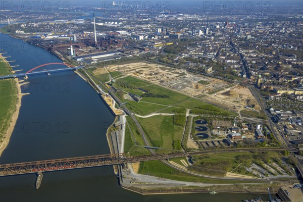 Aerial view, Rheinpark Duisburg on the river Rhine and planned residential complex RheinOrt Hochfeld, future IGA site, historic Hochfeld railway bridge and bridge of solidarity with red railings, distant view, Hochfeld, Duisburg, Ruhr area, North Rhine-Westphalia, Germany