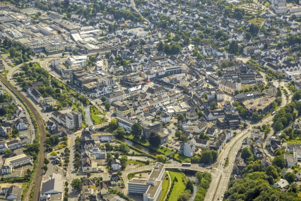 Aerial view, city centre view with Stiftsplatz and St. Walburga catholic church, car park Stiftsplatz with parking deck, Meschede city, Meschede, Sauerland, North Rhine-Westphalia, Germany, old town, place of worship, city, DE, Europe, religious community, place of worship, holy place, city centre view, church, parish, denomination, aerial view, aerial photography, aerial photography, site view, religion, religious site, Ruhr area, city, townscape, city centre, overview, bird's-eye view, bird's-eye view, overview