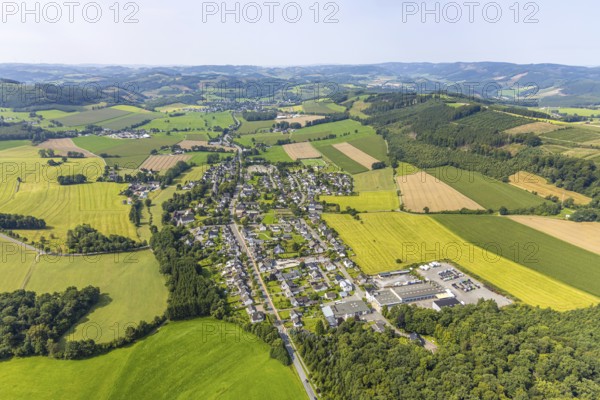 Aerial view, residential area local view district Reiste, meadows and fields and distant view with hilly landscape, Reiste, Eslohe, Sauerland, North Rhine-Westphalia, Germany, DE, Europe, property tax, hilly landscape and distant view, real estate, aerial view, aerial photography, aerial photography, Meschede, Ruhr area, overview, bird's-eye view, meadows and fields, meadow area, meadow landscape, housing estate, housing and living, residential area, quality of living, residential neighbourhood, housing estate, residential area, birds-eyes view, overview