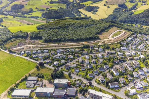 Aerial view, construction site, construction road An der Sündelt for planned new development area, Meschede-Stadt, Meschede, Sauerland, North Rhine-Westphalia, Germany, construction work, construction area, building site, building plots, construction project, construction site, DE, Europe, large construction site, aerial photograph, aerial photography, aerial photography, new construction, Ruhr area, overview, bird's-eye view, bird's-eye view, overview