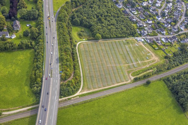 Aerial view, construction of a solar park next to the A46 motorway, Hermannswiese, Wennemen, Meschede, Sauerland, North Rhine-Westphalia, Germany, motorway, construction work, construction area, building site, building plots, construction project, construction site, DE, Europe, photovoltaics, aerial view, aerial photography, aerial photography, new construction, photovoltaic plant, Ruhr area, solar, solar plant, solar energy, solar power plant, overview, bird's eye view, birds-eyes view, overview