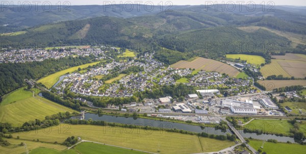 Aerial view, residential area local view district Freienohl, commercial area Bahnhofstraße, river Ruhr nature reserve and wooded hilly landscape, Freienohl, Meschede, Sauerland, North Rhine-Westphalia, Germany, DE, shopping, shopping centre, Europe, commercial enterprise, commercial space, commercial area, commercial property, commercial location, commercial use, property tax, real estate, aerial view, aerial photography, aerial photography, nature reserve, local supply centre, Ruhr area, shopping centre, supermarket, overview, bird's eye view, residential complex, living and life, residential area, residential quality, residential quarter, housing estate, residential district, birds-eyes view, overview