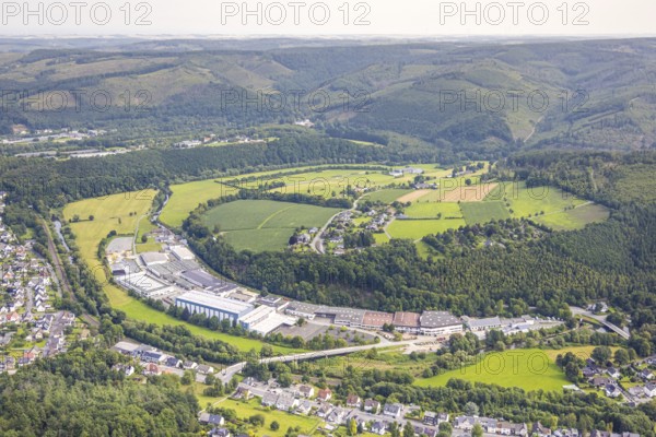 Aerial view, commercial area Im Langel at the edge of the forest, nature reserve Auf'm cock Giesmecketal and Arnsberger Wald, Freienohl, Meschede, Sauerland, North Rhine-Westphalia, Germany, DE, Europe, commercial enterprise, commercial area, commercial property, commercial site, commercial use, industrial area, industrial site, aerial photograph, aerial photography, aerial photography, Ruhr area, overview, bird's-eye view, birds-eyes view, overview