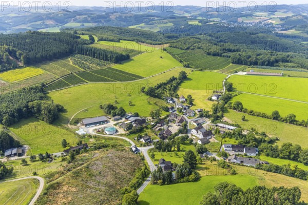 Aerial view, residential area local view district Büemke with chapel St. Agatha, meadows and fields and wooded hilly landscape, Christmas tree cultivation, Reiste, Eslohe, Sauerland, North Rhine-Westphalia, Germany, agriculture, place of worship, farm, DE, Europe, religious community, place of worship, holy place, hilly landscape, hilly landscape and distant view, Church, Agriculture, Agricultural fields, Farm, Aerial view, Aerial photography, Aerial photography, Meschede, Religion, Religious site, Ruhr area, Overview, Bird's-eye view, Meadows and fields, Meadow landscape, birds-eyes view, overview