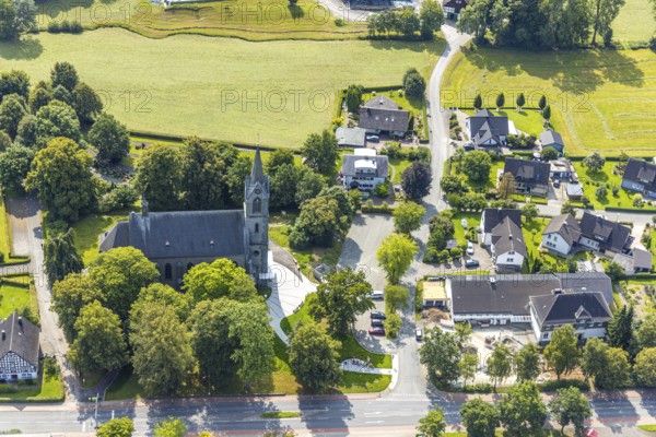Aerial view, St. Pankratius cath. Church, Raphaelschule Eslohe - Reiste sub-location with solar roof, construction site, Reiste, Eslohe, Sauerland, North Rhine-Westphalia, Germany, place of worship, construction work, construction area, building site, building plots, construction project, education, educational institution, DE, roof with solar panels, Europe, religious community, place of worship, sacred site, church, parish, denomination, educational institute, aerial view, aerial photography, aerial photography, Meschede, photovoltaic system, religion, religious site, Ruhr area, school, solar, solar system, solar roof, solar energy, solar panels, solar power system, overview, bird's-eye view, overview