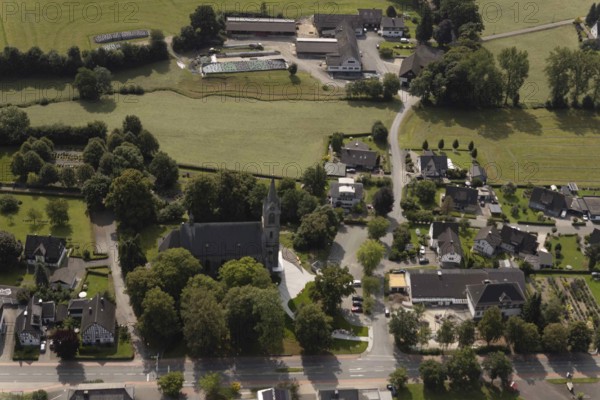 Aerial view, St. Pankratius cath. Church, Raphaelschule Eslohe - Reiste sub-location with solar roof, construction site, Reiste, Eslohe, Sauerland, North Rhine-Westphalia, Germany, place of worship, construction work, construction area, building site, building plots, construction project, education, educational institution, DE, roof with solar panels, Europe, religious community, place of worship, sacred site, church, parish, denomination, educational institute, aerial view, aerial photography, aerial photography, Meschede, photovoltaic system, religion, religious site, Ruhr area, school, solar, solar system, solar roof, solar energy, solar panels, solar power system, overview, bird's-eye view, overview
