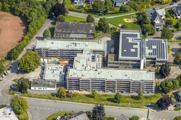 Aerial view, August-Macke-Schulzentrum, St. Walburga catholic secondary school and St. Walburga Realschule Meschede with solar roof, construction site with scaffolding, Meschede town, Meschede, Sauerland, North Rhine-Westphalia, Germany, construction work, construction area, building site, building plots, construction project, construction site, education, educational institution, DE, Europe, secondary school, teaching institute, aerial photograph, aerial photography, aerial photography, new building, secondary school, Ruhr area, school, overview, bird's eye view, bird's eye view, overview
