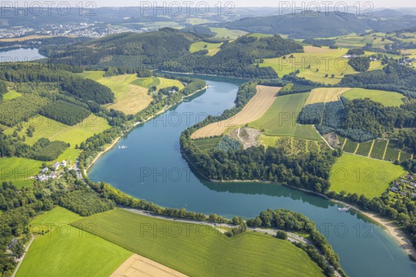 Aerial view, Hennesee and wooded hilly landscape, below H1 am See restaurant with green roof, sandy beach and adventure playground Piraten Bucht Hennesee, Berghausen, Meschede, Sauerland, North Rhine-Westphalia, Germany, outdoor catering, café, DE, food and drink, Europe, inn, Hennetalsperre, aerial view, aerial photography, aerial photography, restaurant, Ruhr area, sunshades, playground, overview, bird's eye view, birds-eyes view, overview