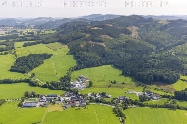 Aerial view, residential area local view district Herhagen surrounded by meadows and fields, forest area with forest damage, Herhagen, Eslohe, Sauerland, North Rhine-Westphalia, Germany, tree mortality, DE, Europe, property tax, hilly landscape, hilly landscape and distant view, real estate, clear cutting, calamity areas, aerial view, aerial photography, aerial photography, Meschede, Ruhr area, overview, bird's-eye view, forest, forest damage, forest dieback, meadows and fields, meadow area, meadow landscape, housing estate, housing and living, residential area, housing quality, residential neighbourhood, housing estate, residential area, birds-eyes view, overview