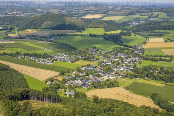 Aerial view, residential area local view district Altenhellefeld, meadows and fields in hilly landscape, behind mountain and Hardt forest area with forest damage, Altenhellefeld, Sundern, Sauerland, North Rhine-Westphalia, Germany, tree mortality, DE, Europe, property tax, real estate, clear cutting, calamity areas, aerial view, aerial photography, aerial photography, Meschede, Ruhr area, overview, bird's-eye view, forest, forest damage, forest dieback, residential area, housing and living, residential area, residential quality, residential neighbourhood, housing estate, residential area, birds-eyes view, overview