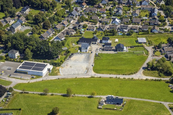 Aerial view, residential area local view district Rönsahl with Netto supermarket and solar roof, Meienborn, Rönsahl, Kierspe, Sauerland, North Rhine-Westphalia, Germany, DE, roof with solar panels, Europe, property tax, real estate, aerial view, aerial photography, aerial photography, photovoltaic plant, Ruhr area, chimney, solar, solar plant, solar roof, solar energy, solar panels, solar power plant, overview, bird's-eye view, residential complex, living and life, residential area, quality of life, residential neighbourhood, housing estate, residential area, birds-eyes view, overview