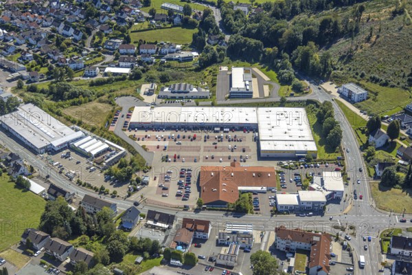 Aerial view, shopping centre with car park Kölner Straße, Kierspe, Sauerland, North Rhine-Westphalia, Germany, DE, shopping, shopping centre, shopping markets, shopping place, shopping mall, Europe, aerial view, aerial photography, aerial photography, local supply centre, Ruhr area, shopping centre, supermarket, overview, bird's eye view, birds-eyes view, overview