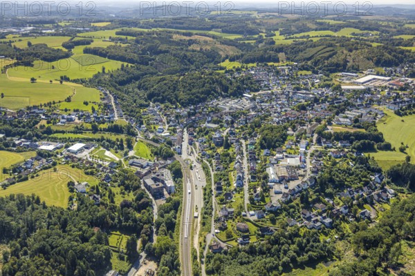 Aerial view, railway station with platform and bus station ZOB, left VolmeFreizeitPark, residential area Am Nocken, Kierspe railway station, Kierspe, Sauerland, North Rhine-Westphalia, Germany, railway area, railway station, platform, DE, Deutsche Bahn AG, Europe, track systems, tracks, property tax, real estate, aerial view, aerial photography, aerial photography, Ruhr area, overview, bird's-eye view, residential area, housing and living, residential area, residential quality, residential neighbourhood, housing estate, residential district, ZOB bus station, birds-eyes view, overview