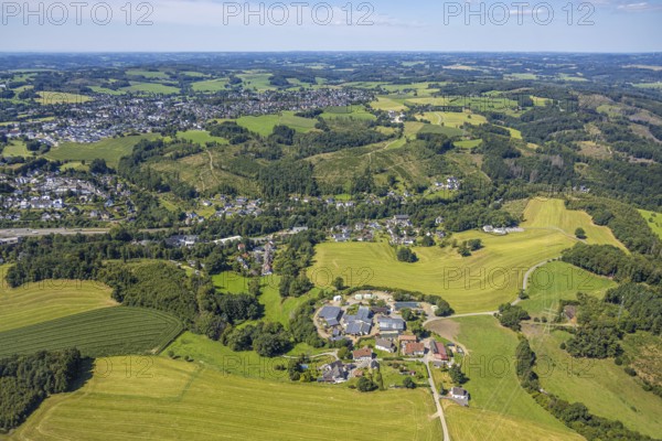 Aerial view, Schriever's Bauernladen farm shop with solar roof, Vorderste Berg, forest area with distant view, Kierspe, Sauerland, North Rhine-Westphalia, Germany, DE, shopping, shopping place, Europe, agricultural farm, aerial view, aerial photography, aerial photography, Ruhr area, overview, bird's eye view, birds-eyes view, overview