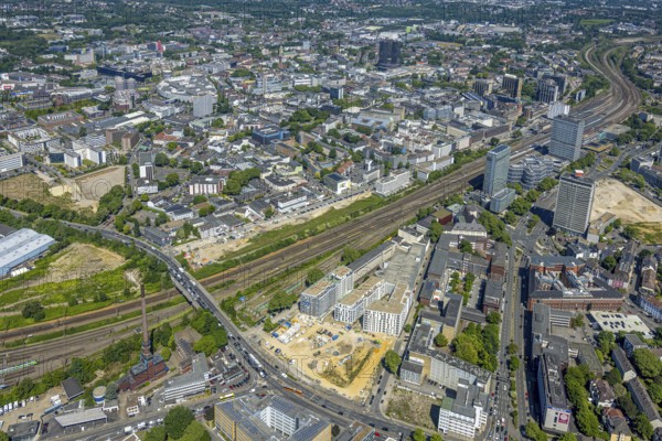 Aerial view, city centre view and construction site of new literature quarter for offices and flats between Sachsenstraße and Bert-Brecht-Straße, railway tracks to main station, Südviertel, Essen, Ruhr area, North Rhine-Westphalia, Germany