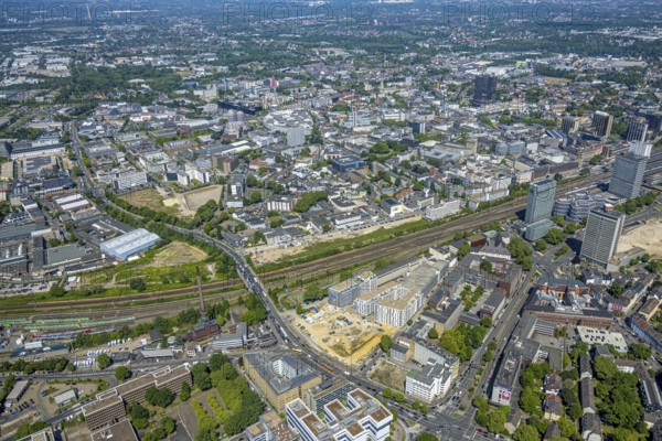 Aerial view, city centre view and construction site of new literature quarter for offices and flats between Sachsenstraße and Bert-Brecht-Straße, railway tracks to main station, Südviertel, Essen, Ruhr area, North Rhine-Westphalia, Germany