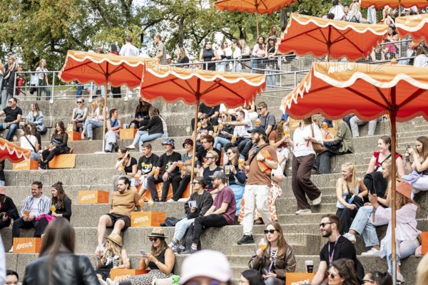 Visitors relax at the Aperol stand at the Superbloom Festival, Day 1 in the Olympic Park, Munich, 30/08/2025