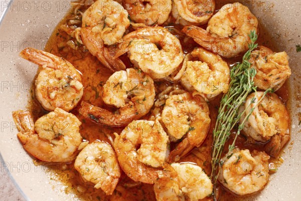 Shrimp dish cooked, in savory sauce. with fragrant herbs, and spices
